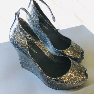 Wedge peep-toe heel sparkle jellies w/ anklestrap.